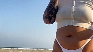 Redhead Flashes Big Swollen Pussy On Beach!