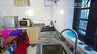 Plumber helping housewife in kitchen while husband away