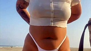 Redhead Flashes Big Swollen Pussy On Beach!