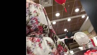 in the store, a hot granny gets spied on with upskirt views.