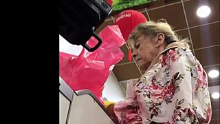 in the store, a hot granny gets spied on with upskirt views.