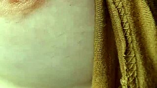 Amateur woman goes braless, nipples visible.