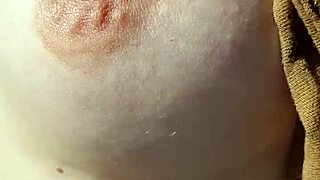 Amateur woman goes braless, nipples visible.