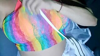 Cute brunette flashes clit in car during carnival.