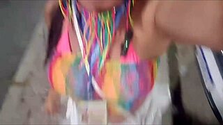 Cute brunette flashes clit in car during carnival.