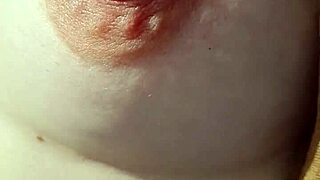 Amateur woman goes braless, nipples visible.