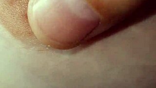 Amateur woman goes braless, nipples visible.