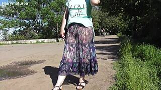 hairy mature woman in transparent dress flashing outdoors