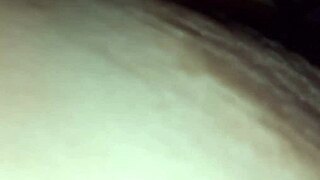 Latte flows from the nipples of a brunette with natural tits