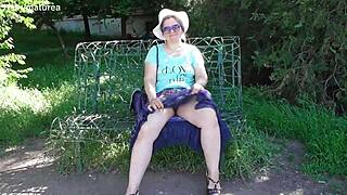 hairy mature woman in transparent dress flashing outdoors