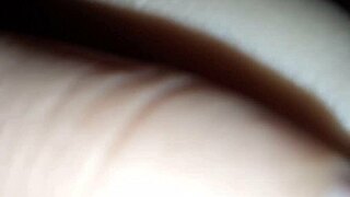 Latte flows from the nipples of a brunette with natural tits