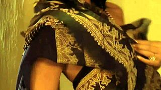 Bollywood Indian MILF dancing nude with clothes ripped and teasing.