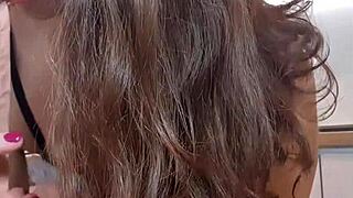 Sexy girl pleasures herself in the kitchen