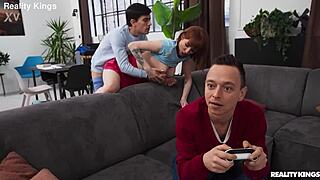 Athletic redhead with big tits bends over in reality kings gamer grind