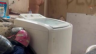 the neighbor hides while the woman washes clothes with her pussy and tits out freely