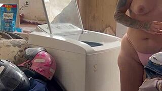 the neighbor hides while the woman washes clothes with her pussy and tits out freely