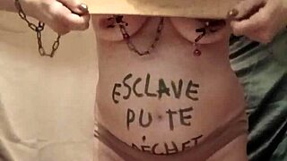 French slave teases with dildo outdoors