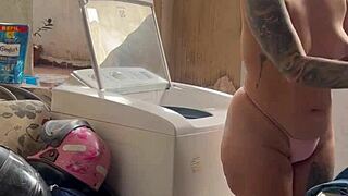 the neighbor hides while the woman washes clothes with her pussy and tits out freely