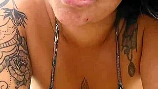 young african woman flashing on usa beach to attract attention