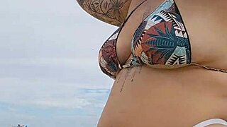 young african woman flashing on usa beach to attract attention