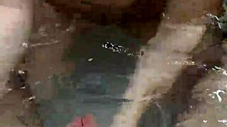 Bath handjob leads to hot underwater cumshot on tits.