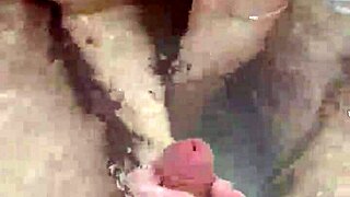 Bath handjob leads to hot underwater cumshot on tits.