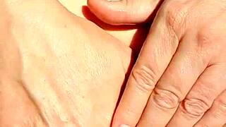 mature vibes fingers and spreads her bald cunt