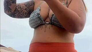 African woman flashes her swollen wet pussy on the beach ready for cock