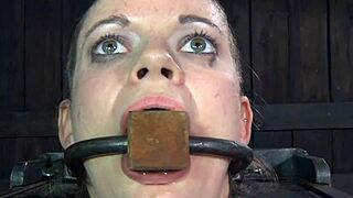 The mouth-gagged slut endures intense machine fucking with choking and domination.