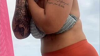 African woman flashes her swollen wet pussy on the beach ready for cock