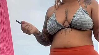 African woman flashes her swollen wet pussy on the beach ready for cock