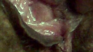 She plays with her pussy in dim light