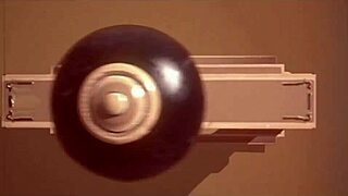 Submissive woman crawls from lagoon in humiliation scene.