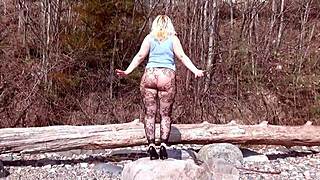 Wow, blonde milf's big ass in fishnet pantyhose on beach! It's so sexy.