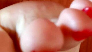 Greta has put beautiful nail polish on her toenails in her homemade video