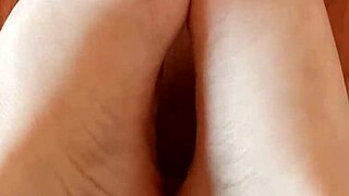 Greta has put beautiful nail polish on her toenails in her homemade video