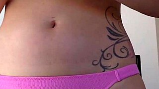 Woman rubs suncream on body during public sunbathing