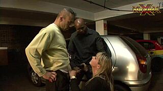 The driver gives a blowjob to the blonde pornstar in public, humiliating the cuckold.