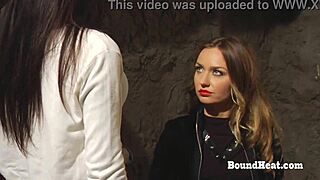 lesbian slave bends over for spanking and fingering by horny madame