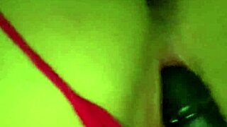 petite girl uses toys for solo play in a comfortable chair