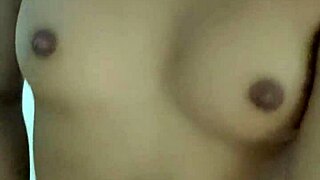 petite girl uses toys for solo play in a comfortable chair