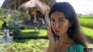 Walking in public cafe while eating pasta carbonara with white sauce on face