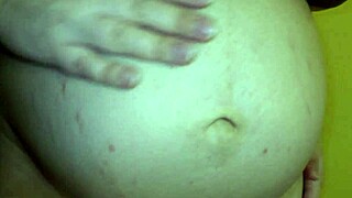 cheating wife with a big pregnant belly having sex with her lover in doggystyle position.