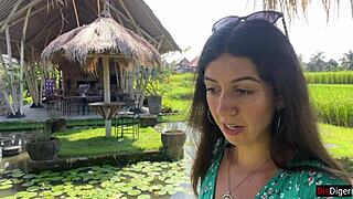 Walking in public cafe while eating pasta carbonara with white sauce on face