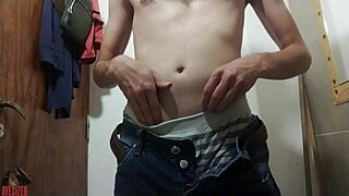 A young amateur questions her sexiness while masturbating in a public bathroom