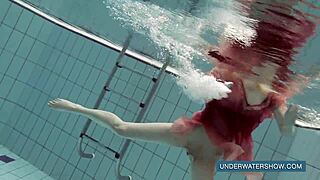 katya okuneva bathes in red dress at pool