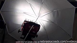 hot chicks helping each other with dildos in public outdoor setting