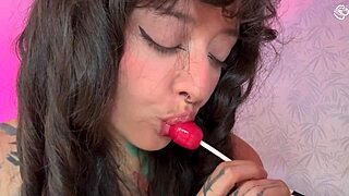 Girl With Split Tongue Licks Lollipop And Inserts In Ass