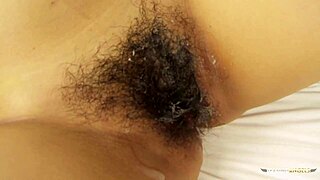Meena sucks and rides a guy's hard dick in the shower, making him cum with her hairy beaver