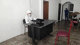 The doctor bangs his secretary on the desk at work, riding him sensually.